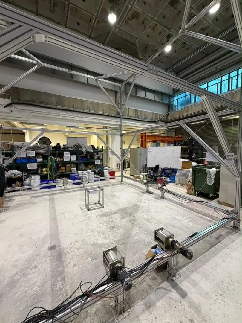 A side view of the assembled CDPR frame with winches along the lower perimeter